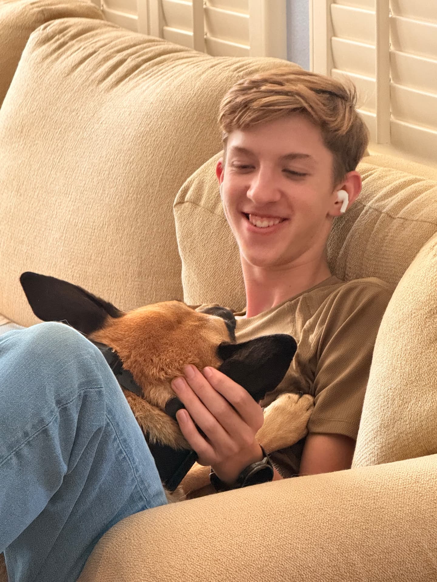 Gavin Will relaxing with a neighborhood dog